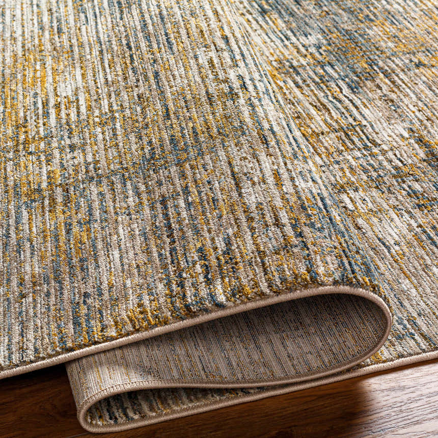 Close-up of the Osma Rich Textured Traditional Rug. Bone, driftwood, multi brown, taupe, and walnut colors. Fold