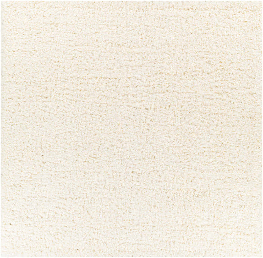 Close-up of the Siari Solid Cream Plush Rug, showing its soft texture and shag pile. Design-Square-710