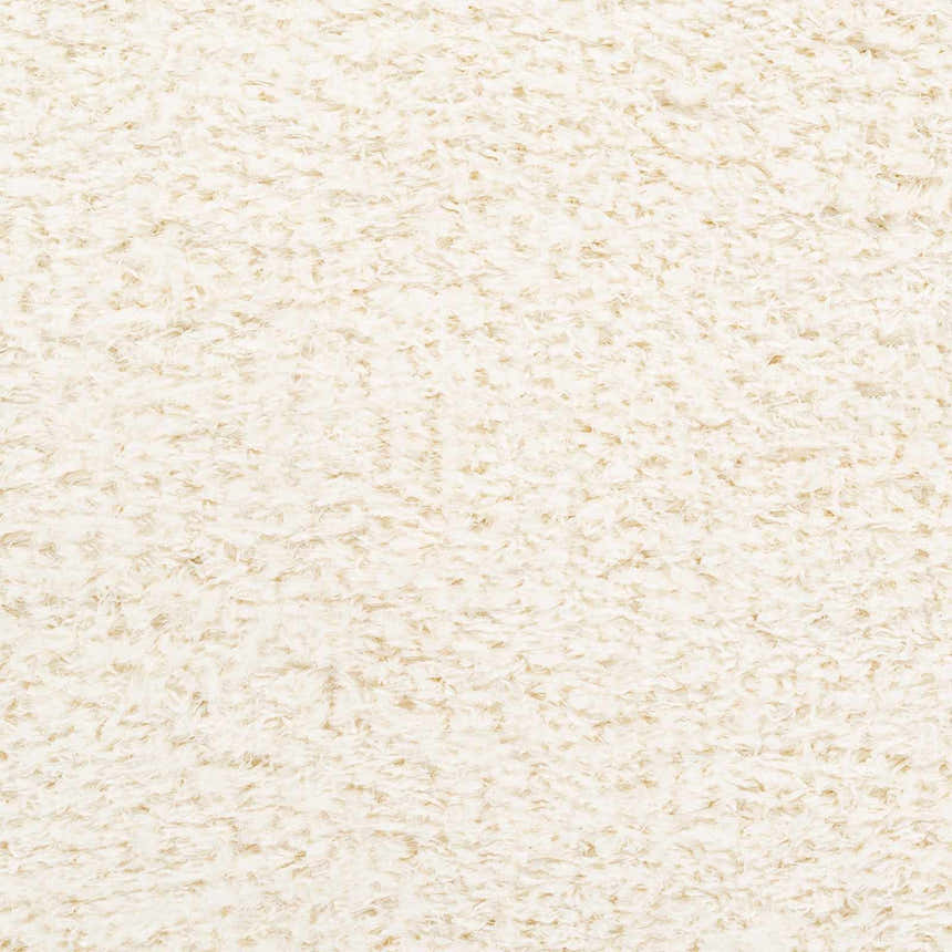 Close-up of the Siari Solid Cream Plush Rug showing its soft, textured shag pile. Swatch