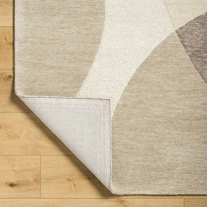 Close-up of Cassiopeia Dark Brown & Beige Area Rug showing wool texture, geometric pattern, and backing detail. Fold