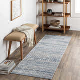Entryway with Tambac Blue Washable Area Rug, wood floors, bench, and bookshelf. Farmhouse style. Roomscene-Runner