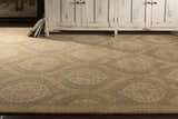 Close-up of Olson Area Rug, a hand-knotted wool rug in neutral tones with a contemporary medallion pattern. Styleshot