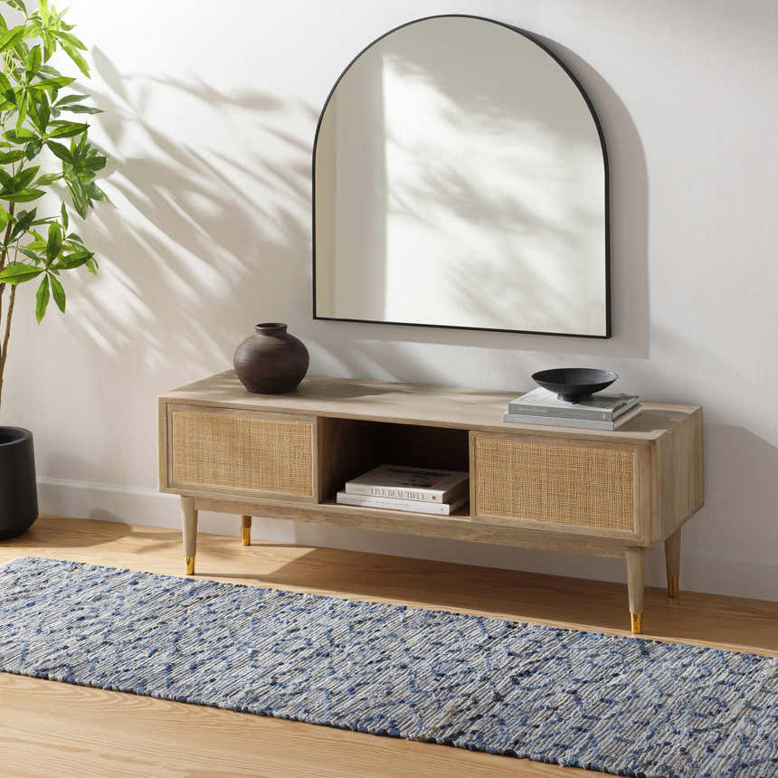 Entryway scene with a Gurit Blue & Brown Area Rug. The rug is styled with a wooden console table and a modern mirror. Roomscene-Runner