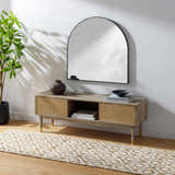 Living room scene with a beige Isaye Area Rug under a modern console table and arched mirror. Roomscene-Runner