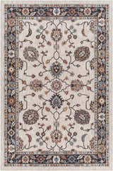 Close-up of Adjoa Area Rug. Traditional floral pattern in black, brown, blue, and cream. Farmhouse style, machine woven. Design-Rectangle-537