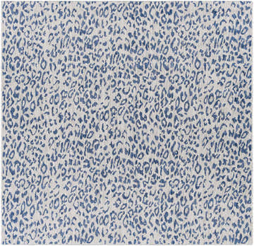 Close-up of the Skipsea Blue Leopard Performance Rug, featuring a blue animal print on a light gray woven texture. Design-Square-67