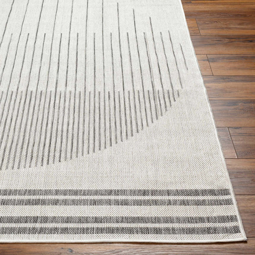 Close up of the Aviya Light Gray Area Rug showing its striped pattern and woven texture on wood floor. Front