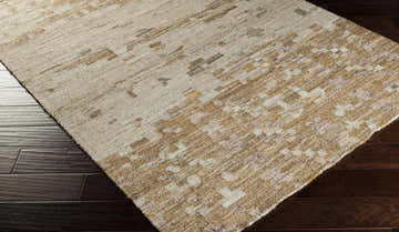 Close-up of Slinger Carpet Area Rug showing hand woven texture and abstract pattern in dark brown, lavender, and gray. Corner