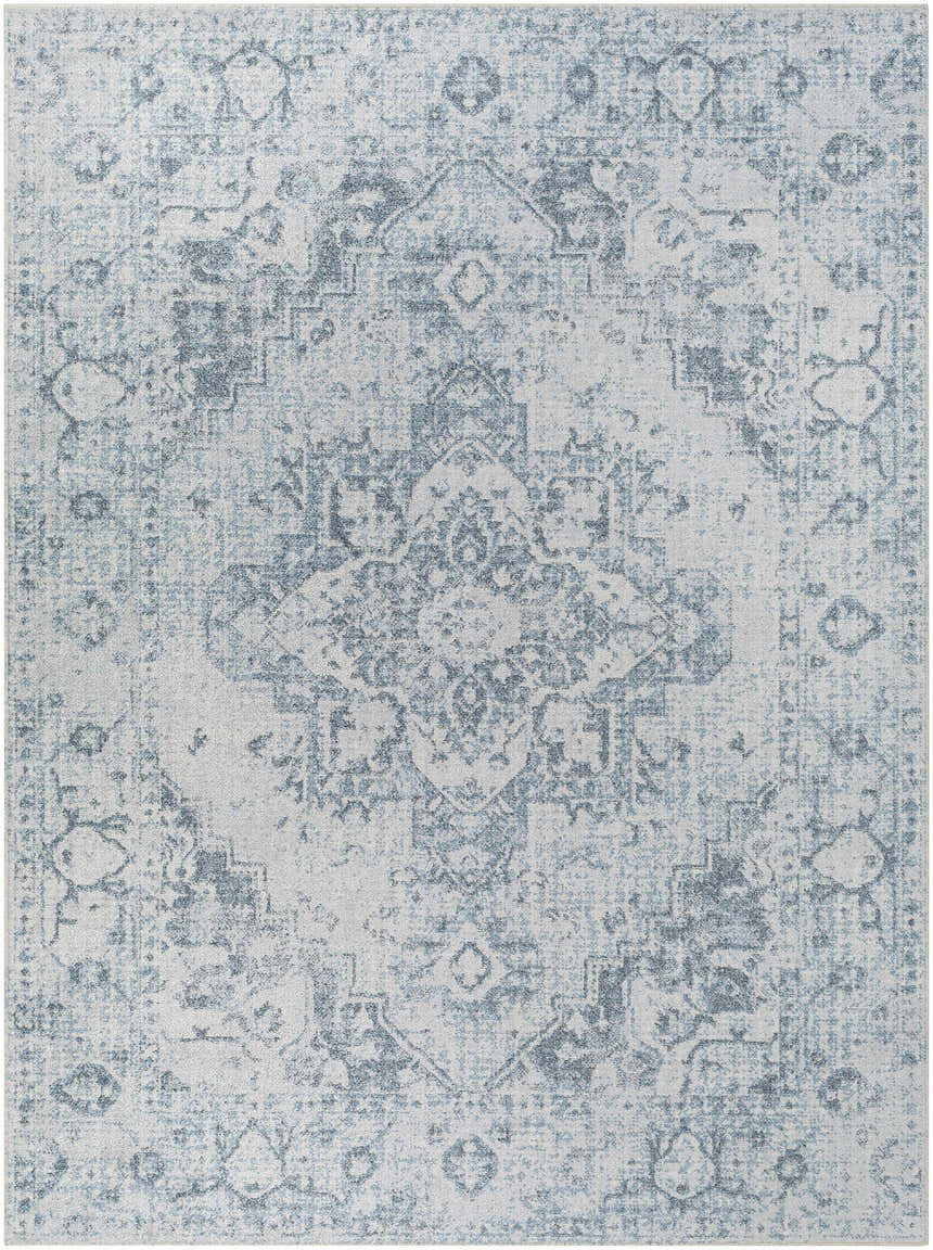 Close-up of the Ankti Aqua Washable Area Rug, featuring a traditional aqua, blue, and off-white distressed pattern. Design-Rectangle-537