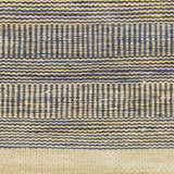 Close-up of the hand woven Blue Elle Area Rug, featuring a geometric pattern in denim and natural jute. Swatch