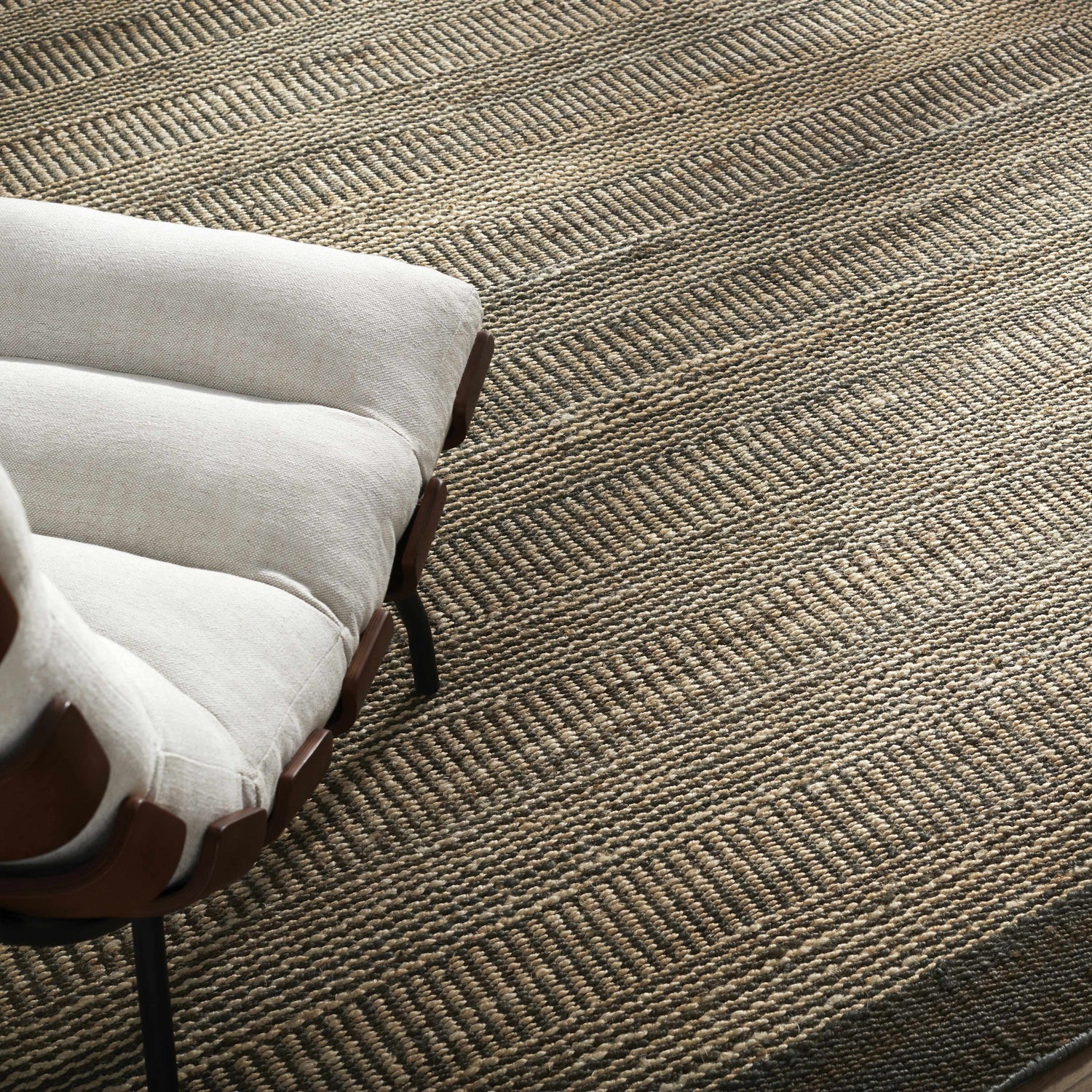 Close-up of the hand woven Gray Elle Area Rug showing its geometric, Scandinavian design and jute texture. Styleshot