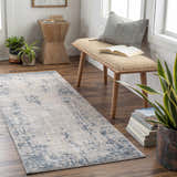 Entryway scene with blue and gray Saltair Textured Luxe Rug, wood bench, plants, and books for a cozy, stylish space. Roomscene-Runner