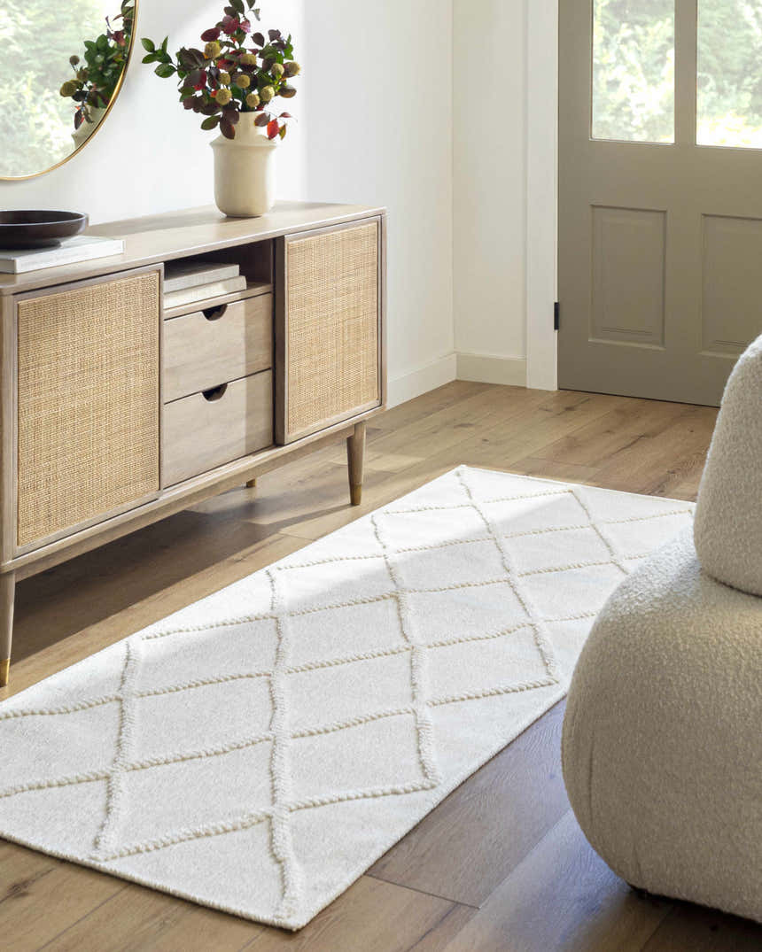 Entryway scene with Amani White Washable Rug, wood floors, console table, round mirror, and neutral decor. Roomscene-Runner