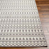 Close-up of the Cili Washable Area Rug. Geometric pattern in cloud gray and light gray on a woven texture. Front