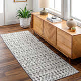 Entryway with Cili Washable Area Rug. Gray and white geometric runner rug on wood floor, near wooden console table. Roomscene-Runner