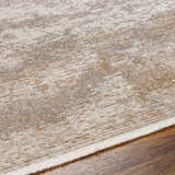 Close up of the Ayah Area Rug showing its light gray and brown contemporary pattern and soft texture. Texture