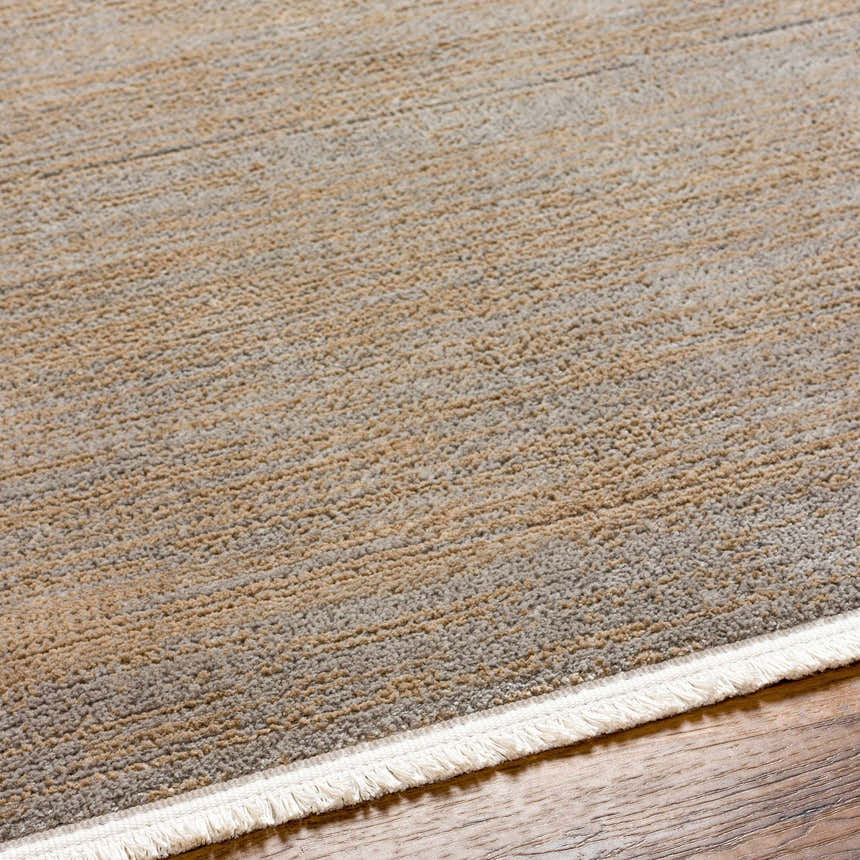 Close-up of the Halyn Area Rug showing beige, gray, and brown horizontal stripes with a white fringe on wood flooring. Texture