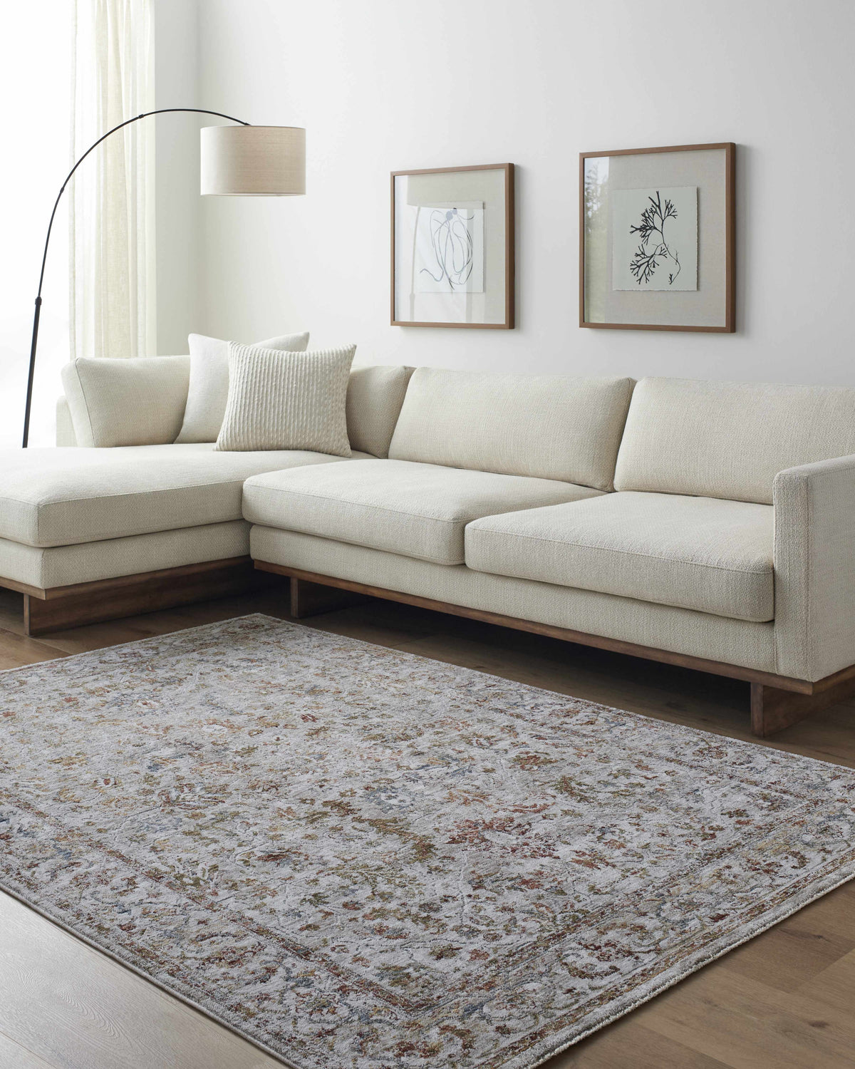 Living room with a neutral couch and the Asabi Tan Textured Rug, adding warmth and pattern to the space. Roomscene-Rectangle