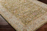 Close-up of the Dyan Green Textured Rug with Fringes, showcasing its traditional floral pattern and soft, muted colors. Corner