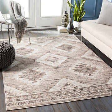 Living room scene with tan sofa and Smoketown Area Rug in black, tan, and white. Roomscene-Rectangle