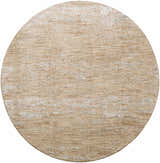 Close-up of a round Jehan Area Rug in tan, featuring a subtle distressed pattern and soft texture. Design-Round-67