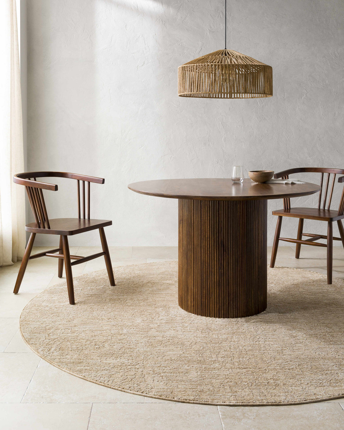 Farmhouse dining room with a round wood table and the Katia Tan Area Rug. Roomscene-Round