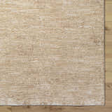 Close-up of the Katia Tan Area Rug showing its khaki and tan colors and subtle farmhouse pattern. Corner
