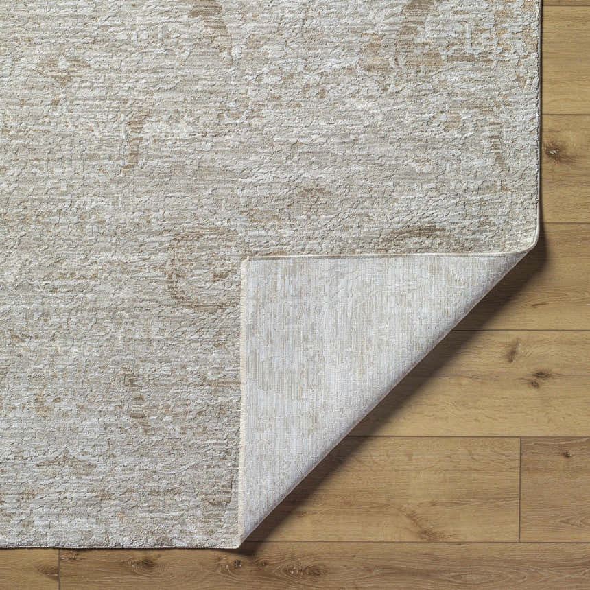 Close-up of the light gray and natural gray Katia Area Rug showing its traditional pattern and woven texture. Fold