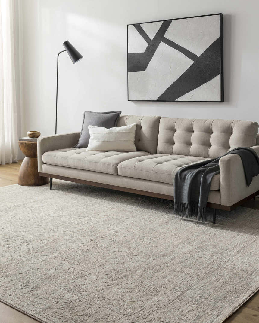Living room with a light gray sofa and the light gray Kyran Area Rug. Roomscene-Rectangle