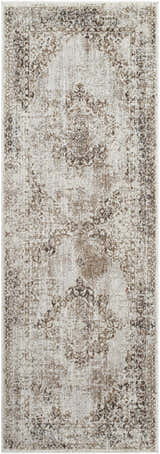 Close-up of a Kosta Beige Medallion Area Rug. The rug features a traditional, distressed medallion pattern in lambswool and light brown. Design-Runner-2773