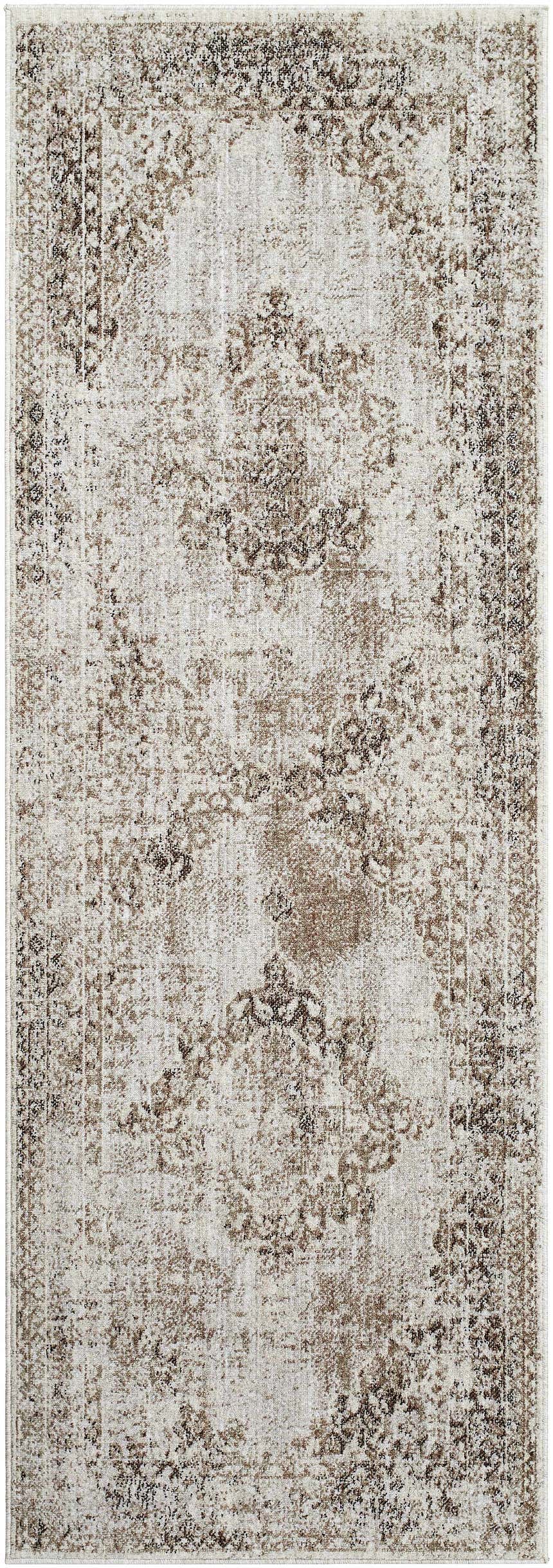 Close-up of a Kosta Beige Medallion Area Rug. The rug features a traditional, distressed medallion pattern in lambswool and light brown. Design-Runner-2773
