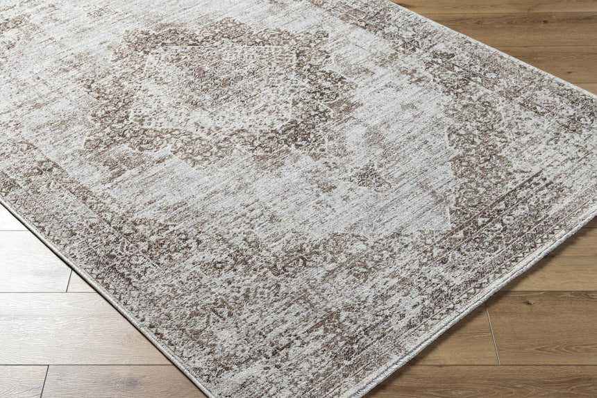 Close-up of Kosta Beige Medallion Area Rug showing farmhouse style, lambswool and light brown colors, and machine woven texture. Corner