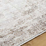 Close-up of the Kosta Beige Medallion Area Rug showing lambswool and light brown colors and machine-woven texture. Texture
