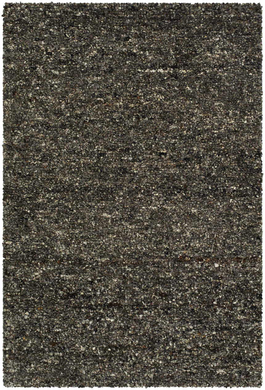 Close-up of the hand-tufted Sevan Black Wool Area Rug. Features jet black, medium gray, and taupe tones. Design-Rectangle-23