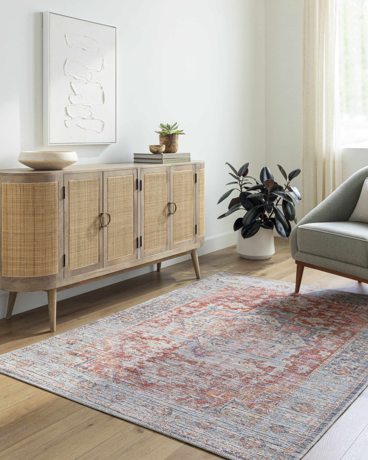 Entryway with a natural wood cabinet and the Azfal Area Rug in burnt orange and gray. Roomscene-Rectangle