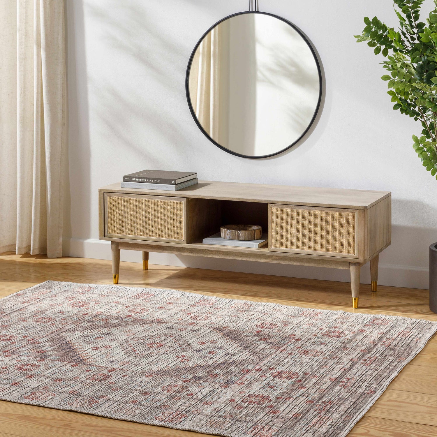 Entryway scene with a Beachhouse Liam Area Rug, wood console table, round mirror, and plant. Roomscene-Rectangle
