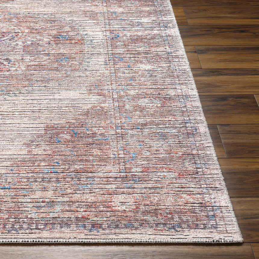 Close up of the Maja Area Rug in multi brown, showing its traditional pattern and textured weave. Front