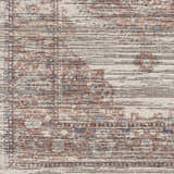 Close-up of the Maja Area Rug. Farmhouse style rug with beachhouse, brown, and blue tones. Machine woven polyester texture. Swatch