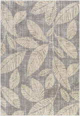 Close-up of the Snook Area Rug, showcasing its beige leaf pattern on a gray textured background. Coastal style rug. Design-Rectangle-5373