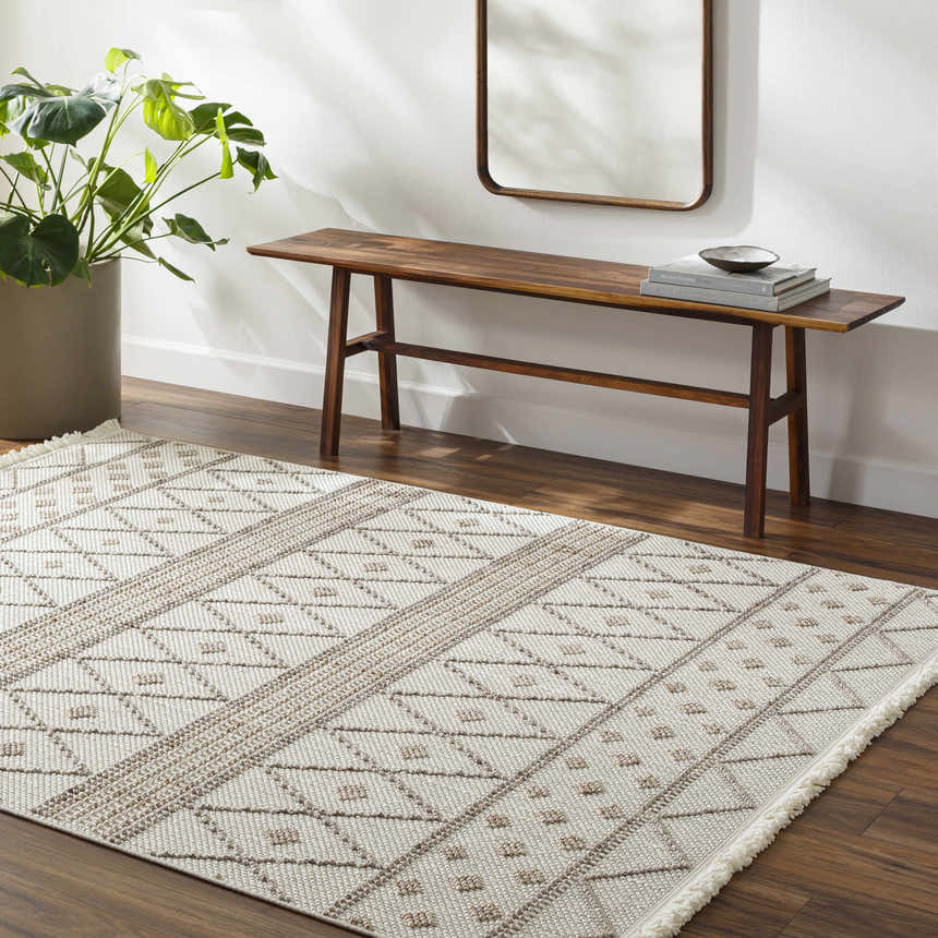 Entryway with a beige Finch Area Rug, wood bench, mirror, and potted plant creating a Scandinavian style. Roomscene-Rectangle