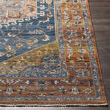 Close-up of the Solana Blue Medallion Area Carpet showing the bohemian pattern, blue, orange, and brown colors. Front
