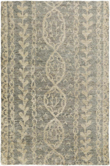 Close-up of the Sonnette Jute Rug. Hand-knotted rug in brown, gray, and ivory with a farmhouse-style geometric pattern. Design-Rectangle-811