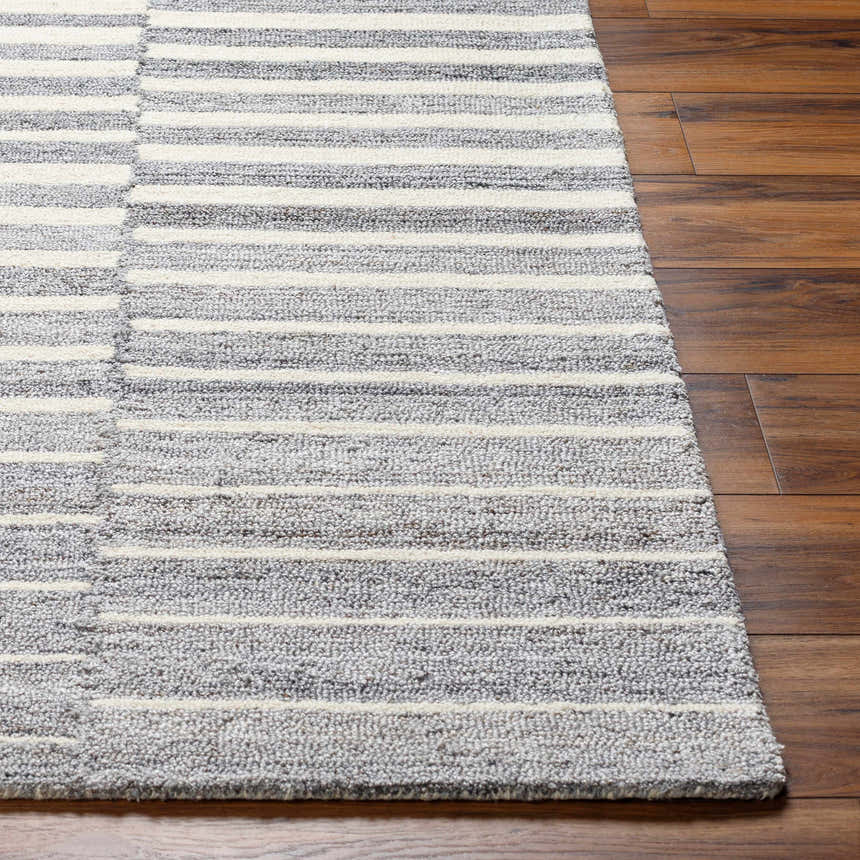 Close-up of Gawel Gray Area Rug showing its hand-tufted texture and contemporary gray and white stripe design. Front