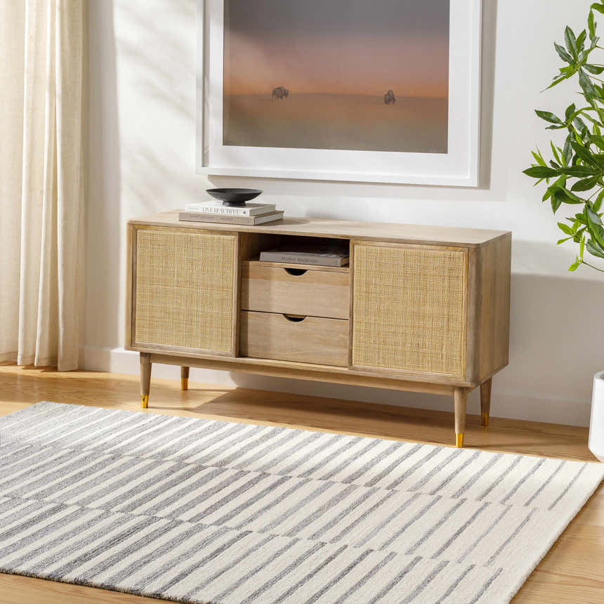 Living room scene with a light wood console table and the Gawel Gray Area Rug. Roomscene-Rectangle