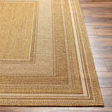 Close-up of the Chael Flatweave Faux Jute Rug showing the beige, camel, and brown tones and woven texture. Front