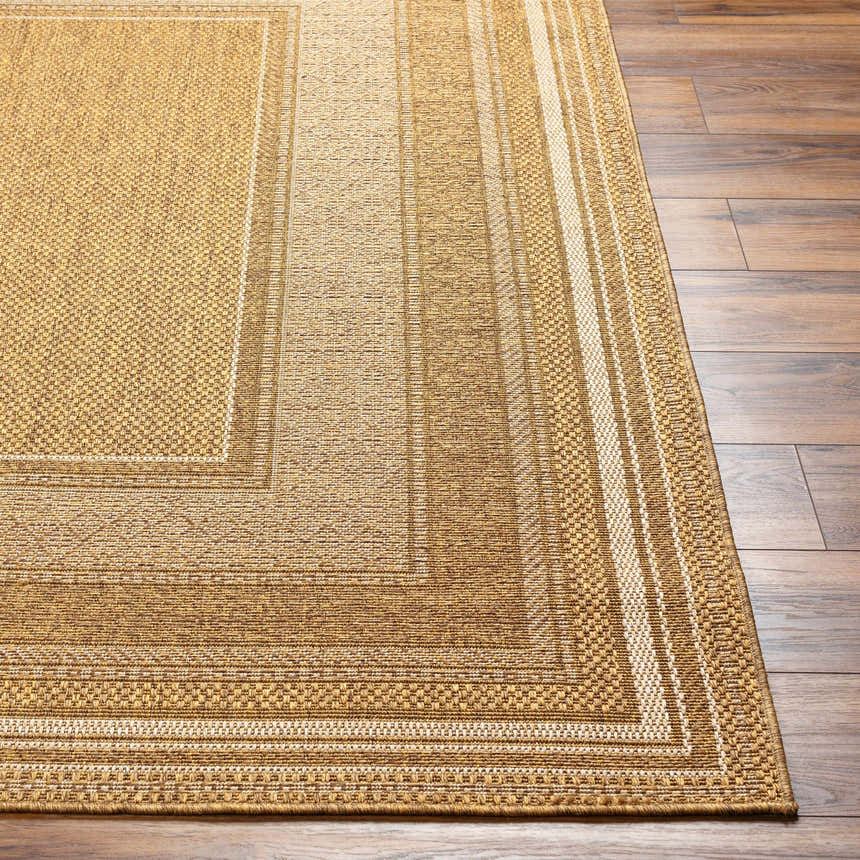 Close-up of the Chael Flatweave Faux Jute Rug showing the beige, camel, and brown tones and woven texture. Front