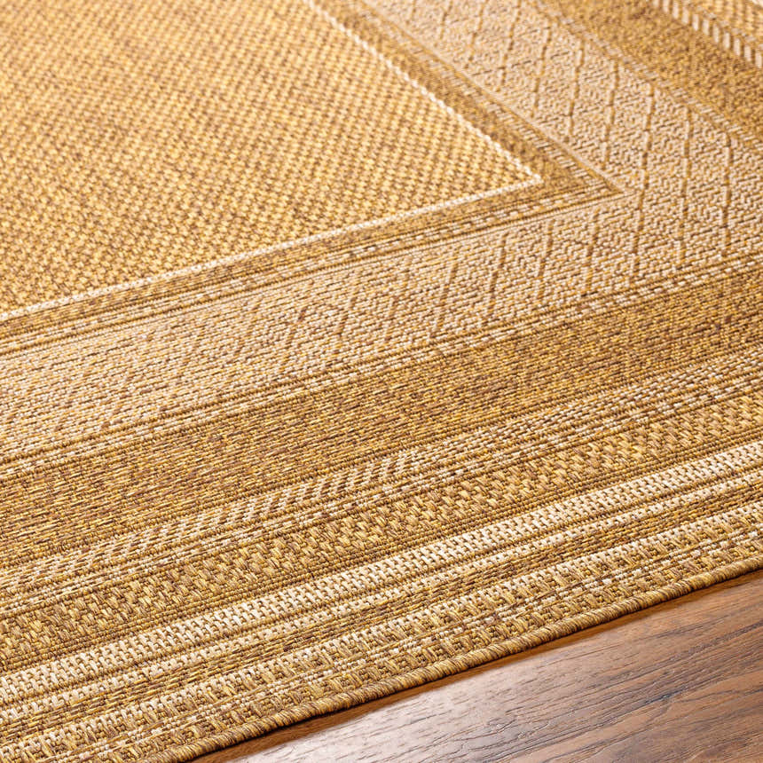 Close-up of the beige Chael Flatweave Faux Jute Rug showing texture, border detail, and polypropylene material. Texture