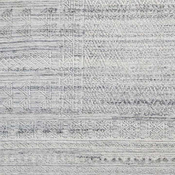 Close-up of the Gray Eldad Area Rug showing its hand-knotted texture and subtle black and metallic silver pattern. Swatch