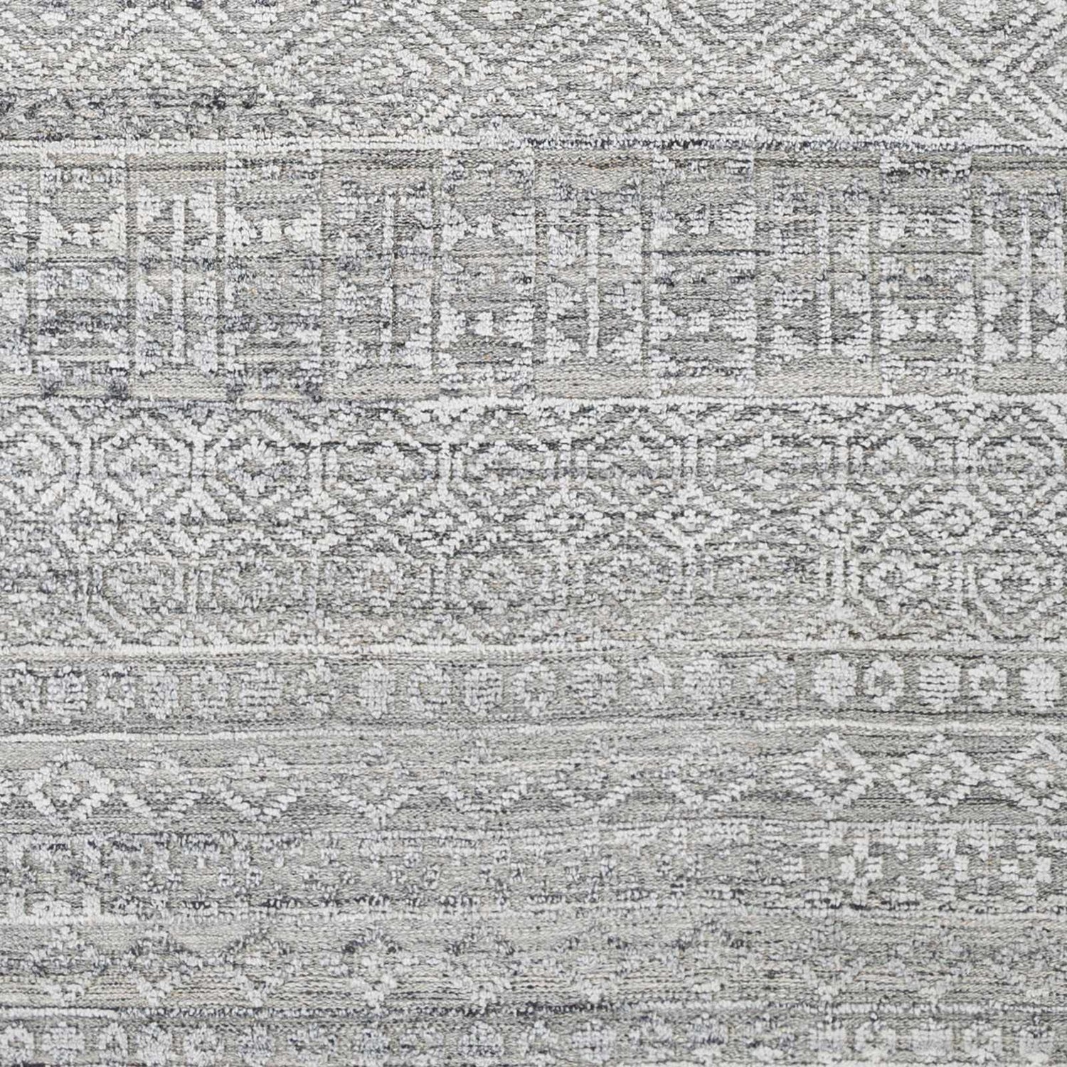 Close-up of Gray Kazi Area Rug. Hand-knotted recycled PET yarn rug with geometric, Scandinavian, Southwestern design. Swatch