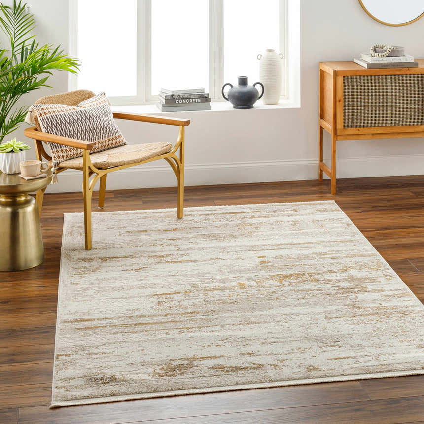 Living room scene with a beige Hudd Area Carpet, wood floors, chair, and natural light from a window. Roomscene-Rectangle